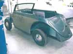 Photo shows the restored 1954 Volkswagen convertible body installed on the chassis and ready to roll