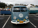 Restored vintage VW bus with large yellow fog lamps