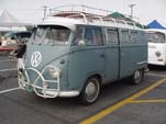 Early Volkswagen sundial camper with vintage front brush guard