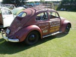 Oval window volkswagen bug with vintage graphics