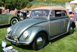 Photo of beautifully restored 1954 Volkswagen convertible bug at a summer car show