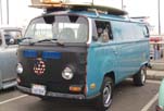 Volkswagen bay window panel van with vintage surfboard roof racks